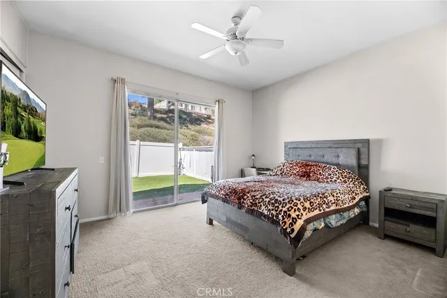 a bed sitting in a room next to a window