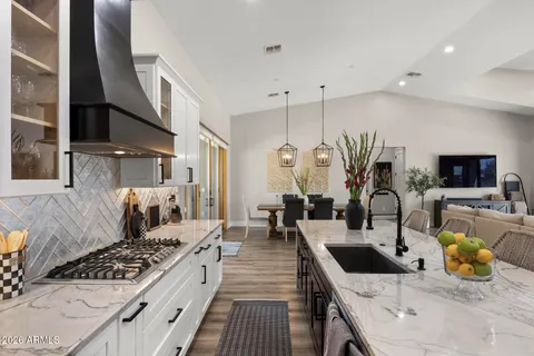 a kitchen with a stove and a refrigerator