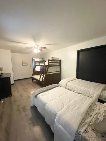 a bedroom with a bed and a television
