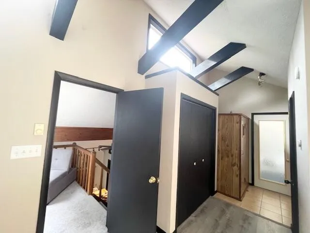 a view of a hallway with storage and utility