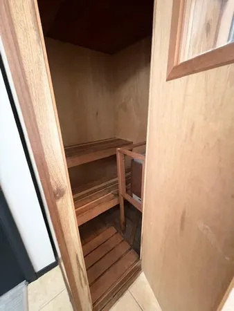 a bedroom with a bed and a table