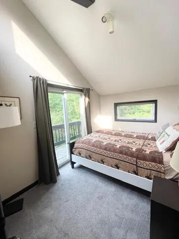 a bedroom with furniture and a window