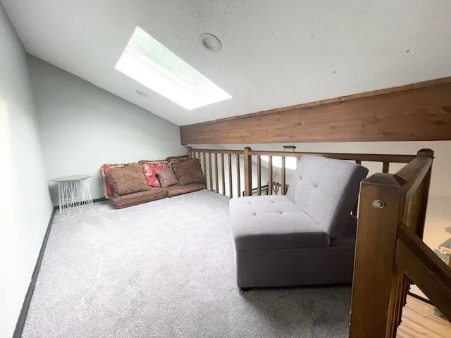 a room with furniture and air hockey table