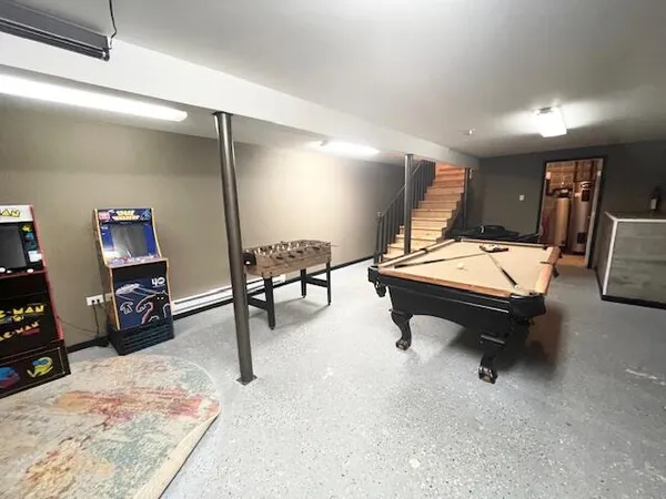 a living room with furniture pool and a flat screen tv