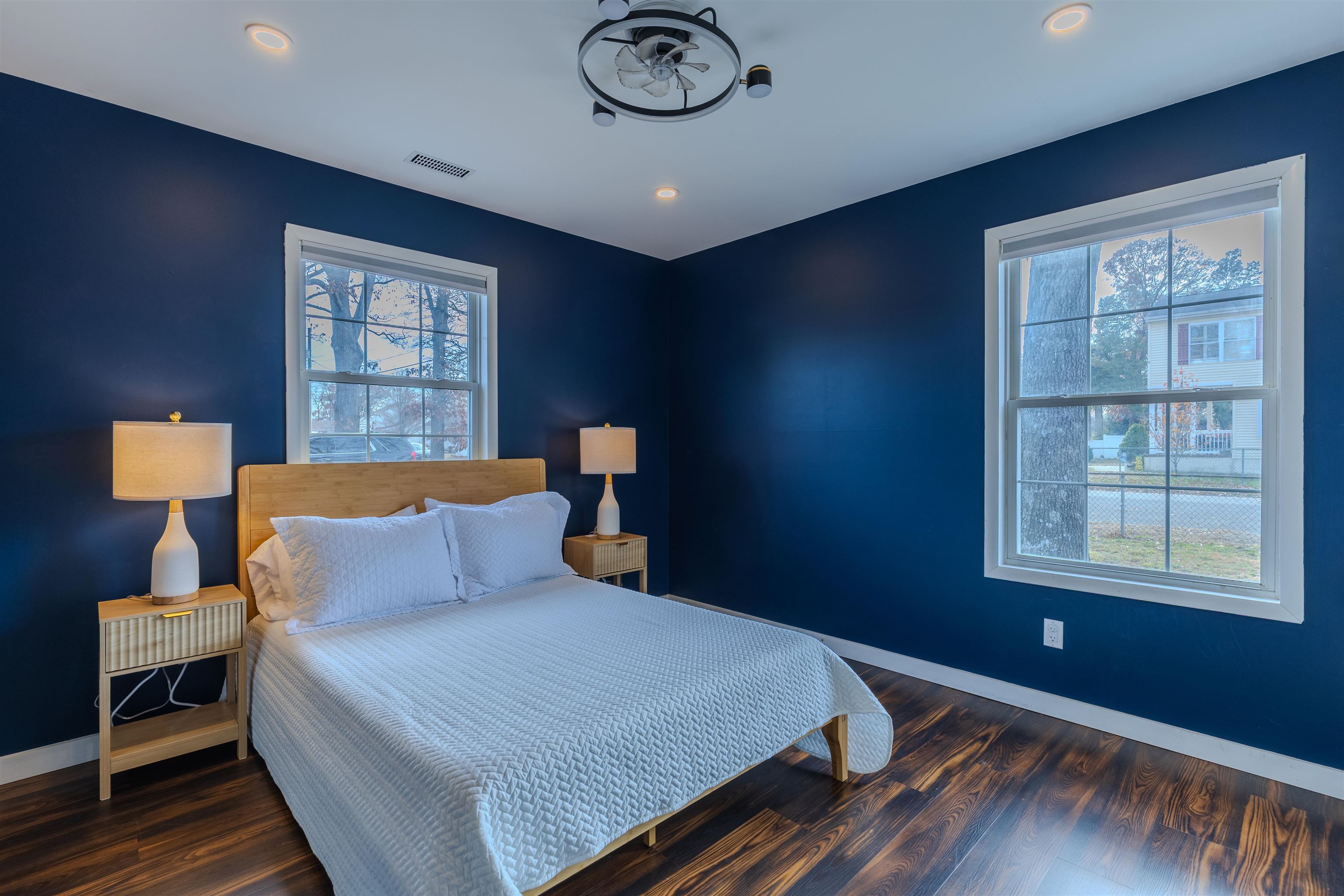 87 Rose Villas, NJ 08251 - Photo 16 of 27 a bedroom with a bed and a lamp