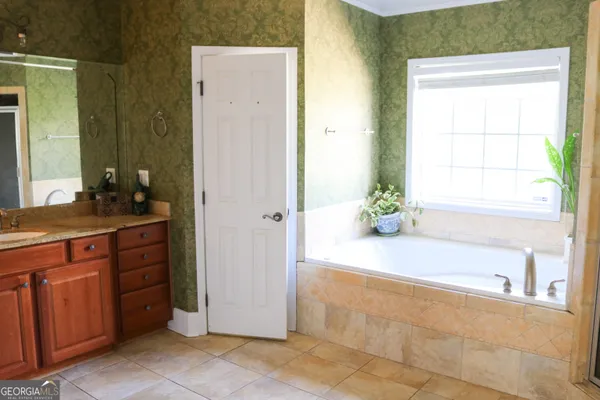 a bathroom with a bathtub and a sink