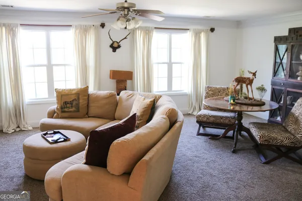a living room with furniture and a window
