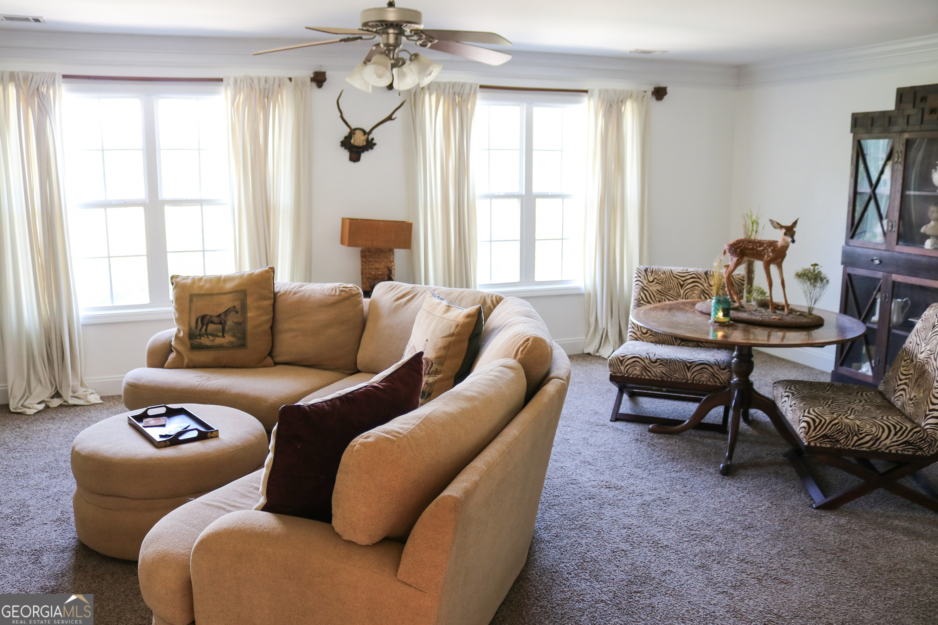 1224 Walker Road Madison, GA 30650 - Photo 29 of 57 a living room with furniture and a window