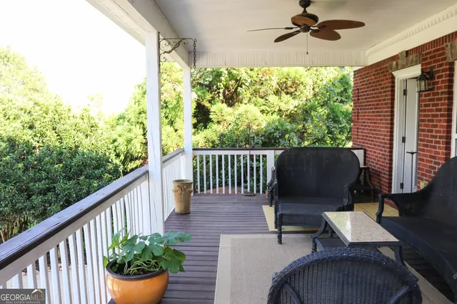a view of a balcony with furniture