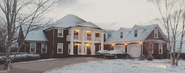 a front view of a building with parking space and parking space