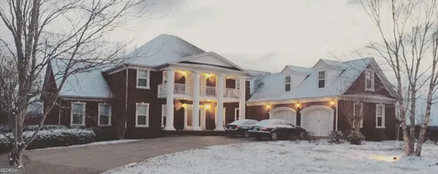 a front view of a building with parking space and parking space