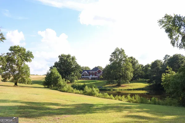 a view of a swimming pool with an outdoor space and seating area