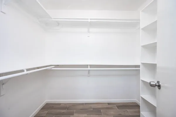 a view of an empty walk in closet