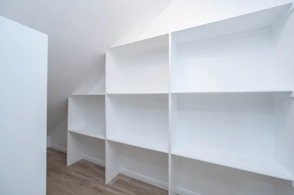 a view of an empty walk in closet