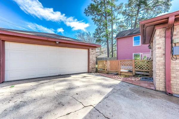 a backyard of a house with yard and garage