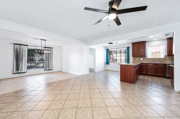 a view of a kitchen with furniture and a window