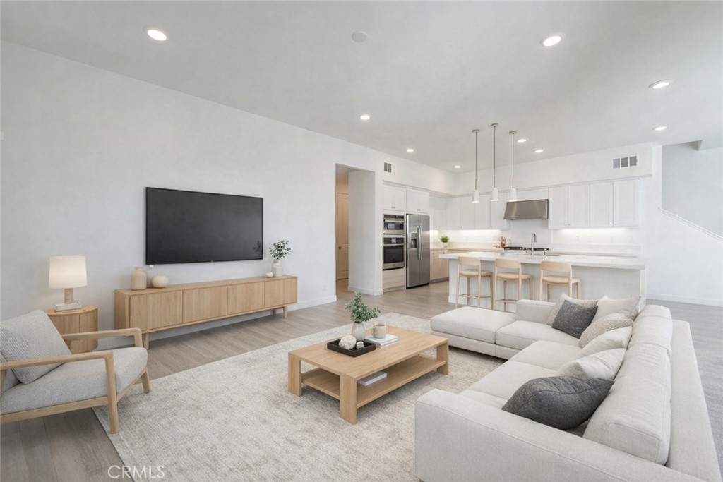 121 Baluster Irvine, CA 92618 - Photo 3 of 80 a living room with furniture and a flat screen tv