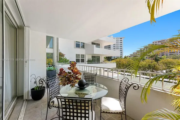 a view of a balcony with chairs