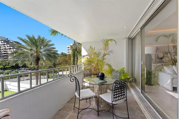 a view of balcony with furniture