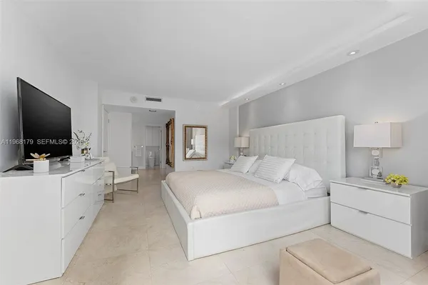 a room with a sink and a mirror