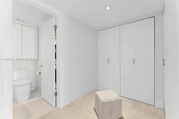 a bathroom with a toilet sink and shower