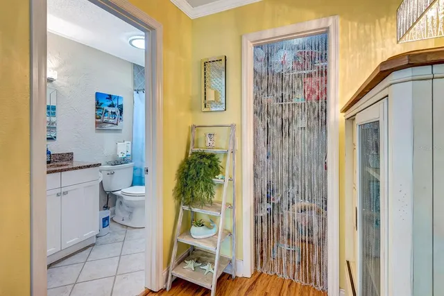 a bathroom with a toilet and a shower curtain