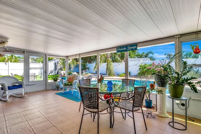 a dining room with furniture water view and a potted plant