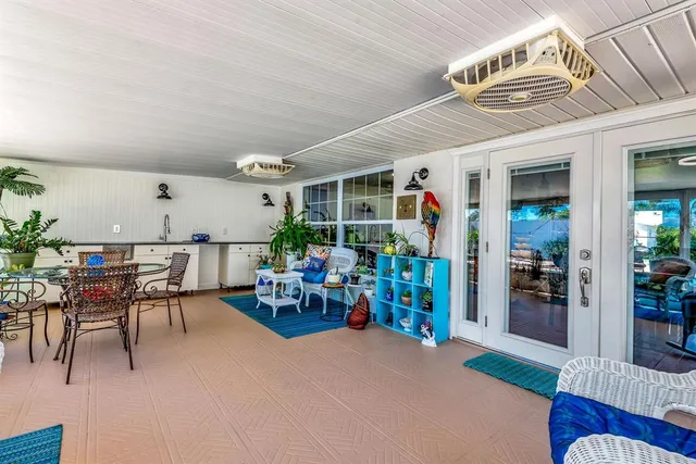 a living room with lots of furniture and a chandelier
