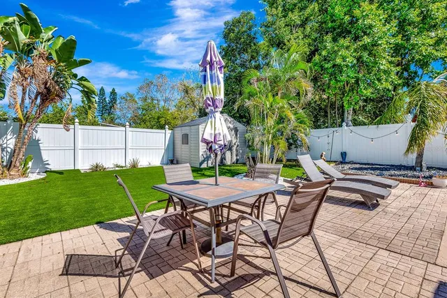a view of an outdoor space with a table and chair