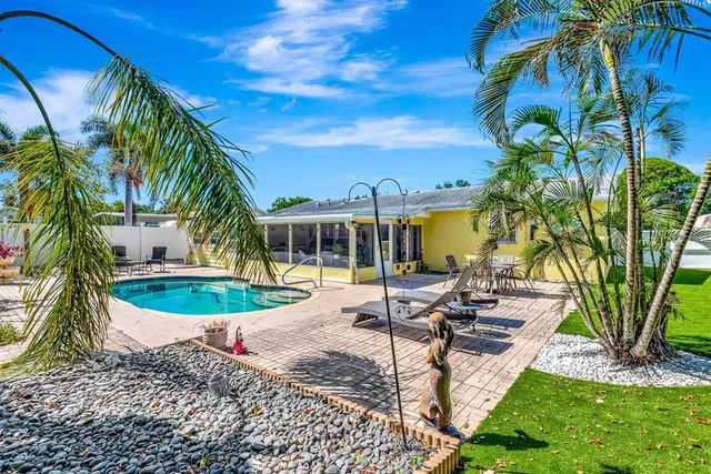 a view of a swimming pool with a patio