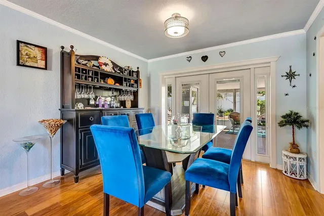 a view of a dining room with furniture and wooden floor