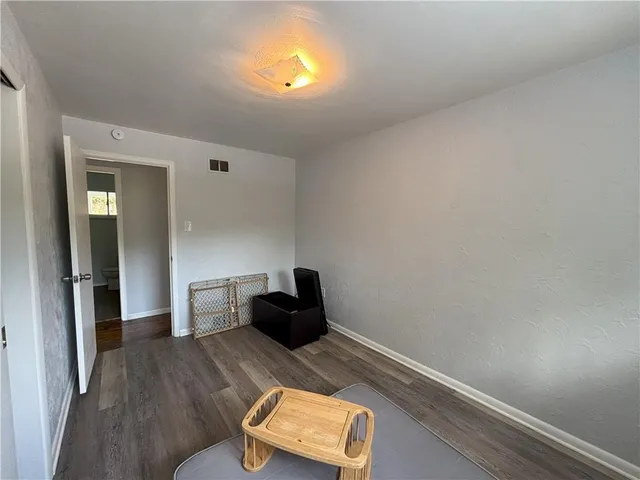 a view of kitchen with furniture and wooden floor