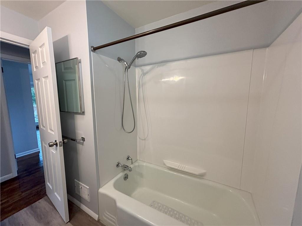 3395 Logan Ferry Road Murrysville, PA 15668 - Photo 23 of 36 a bathroom with a bathtub and a shower