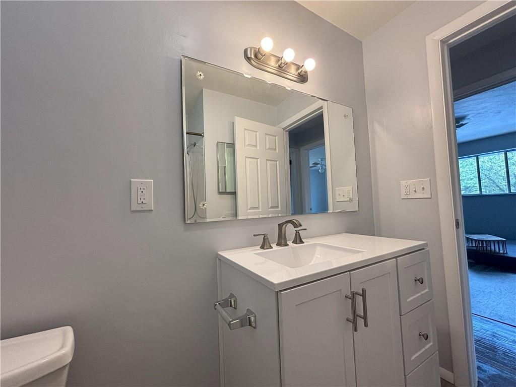 3395 Logan Ferry Road Murrysville, PA 15668 - Photo 24 of 36 a bathroom with a sink a toilet and a mirror