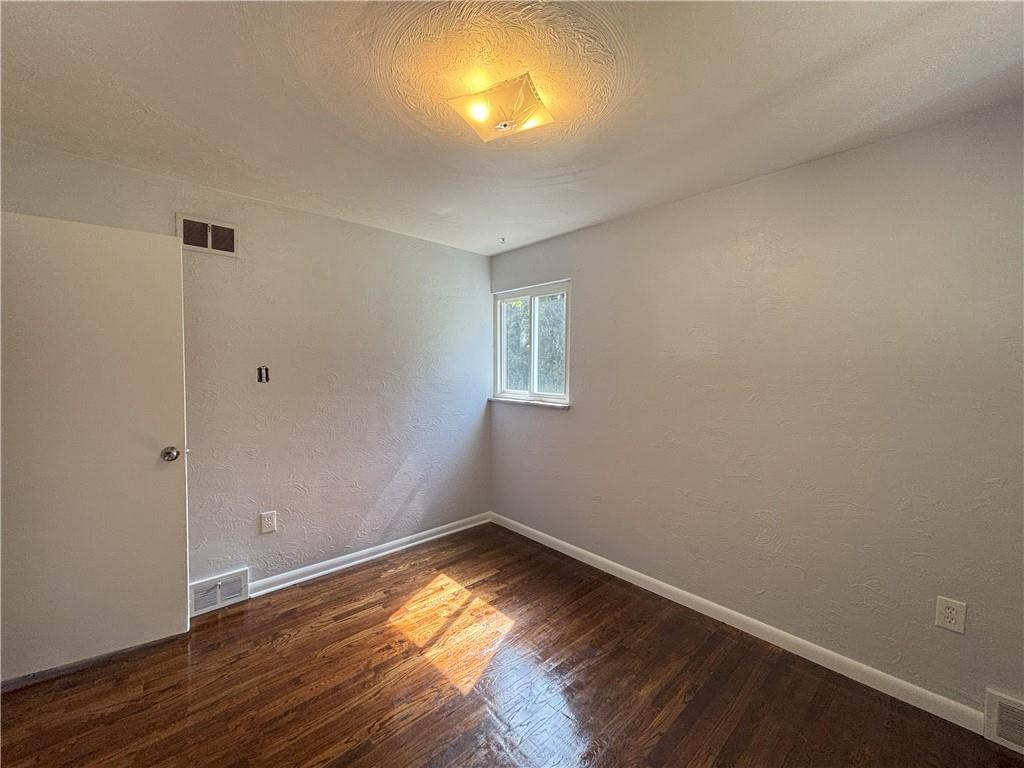 3395 Logan Ferry Road Murrysville, PA 15668 - Photo 31 of 36 a view of empty room with wooden floor and fan