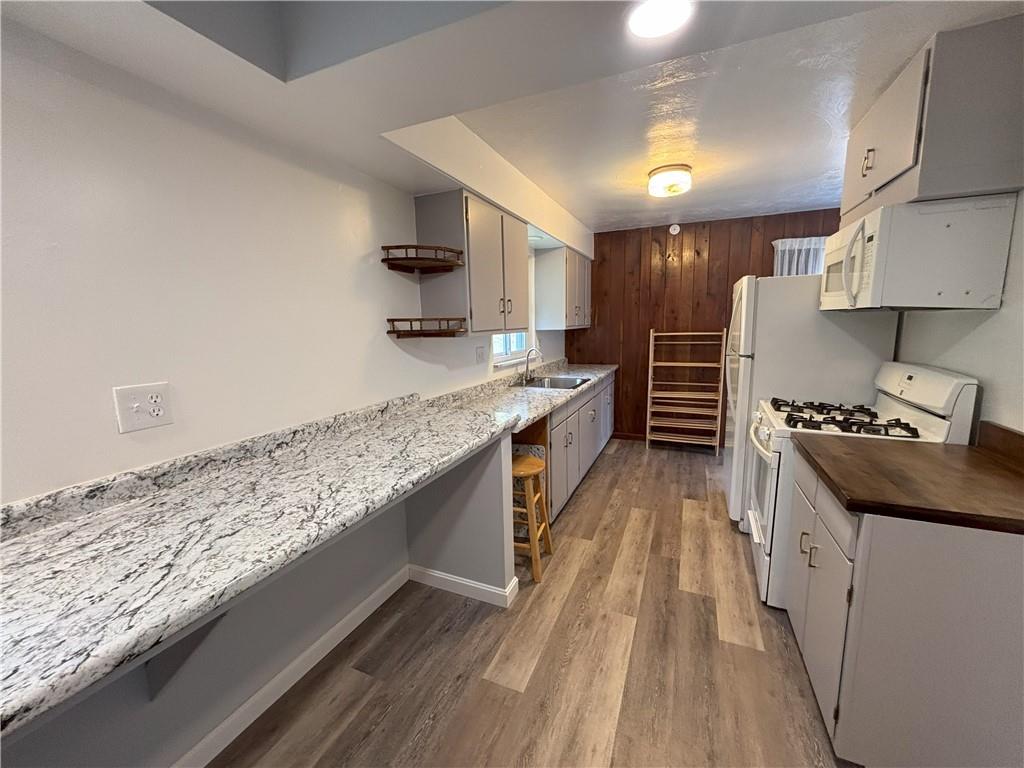 3395 Logan Ferry Road Murrysville, PA 15668 - Photo 10 of 36 a kitchen with stainless steel appliances granite countertop a stove a sink and a refrigerator