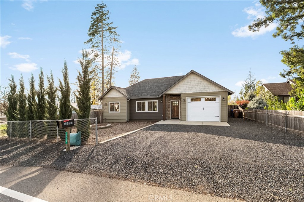 5929 Sawmill Road Paradise, CA 95969 - Photo 1 of 1 a front view of a house with a yard and garage