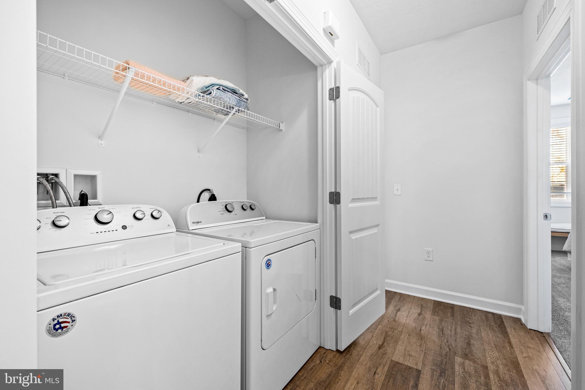 1014 Admiral Lane, Unit 301 Hanover, PA 17331 - Photo 16 of 36 a view of washer and dryer with wooden floor