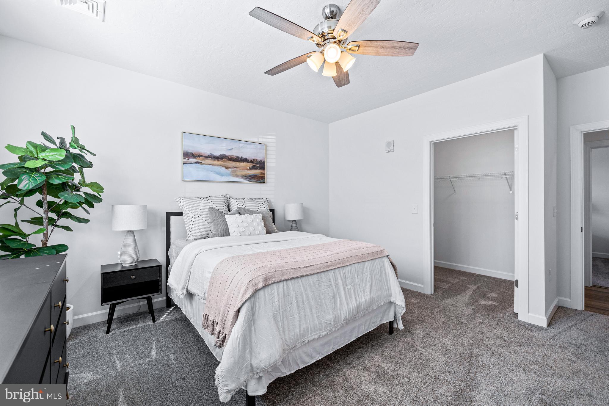 1014 Admiral Lane, Unit 301 Hanover, PA 17331 - Photo 23 of 36 a bedroom with a bed and a chandelier