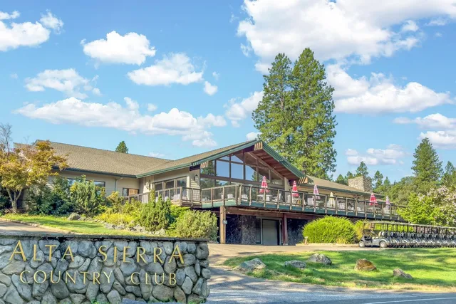a backyard of a house with a yard and lake view