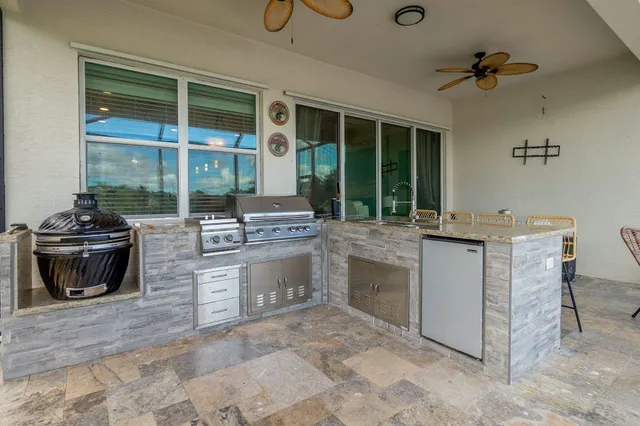 a kitchen with stainless steel appliances granite countertop a stove and a sink