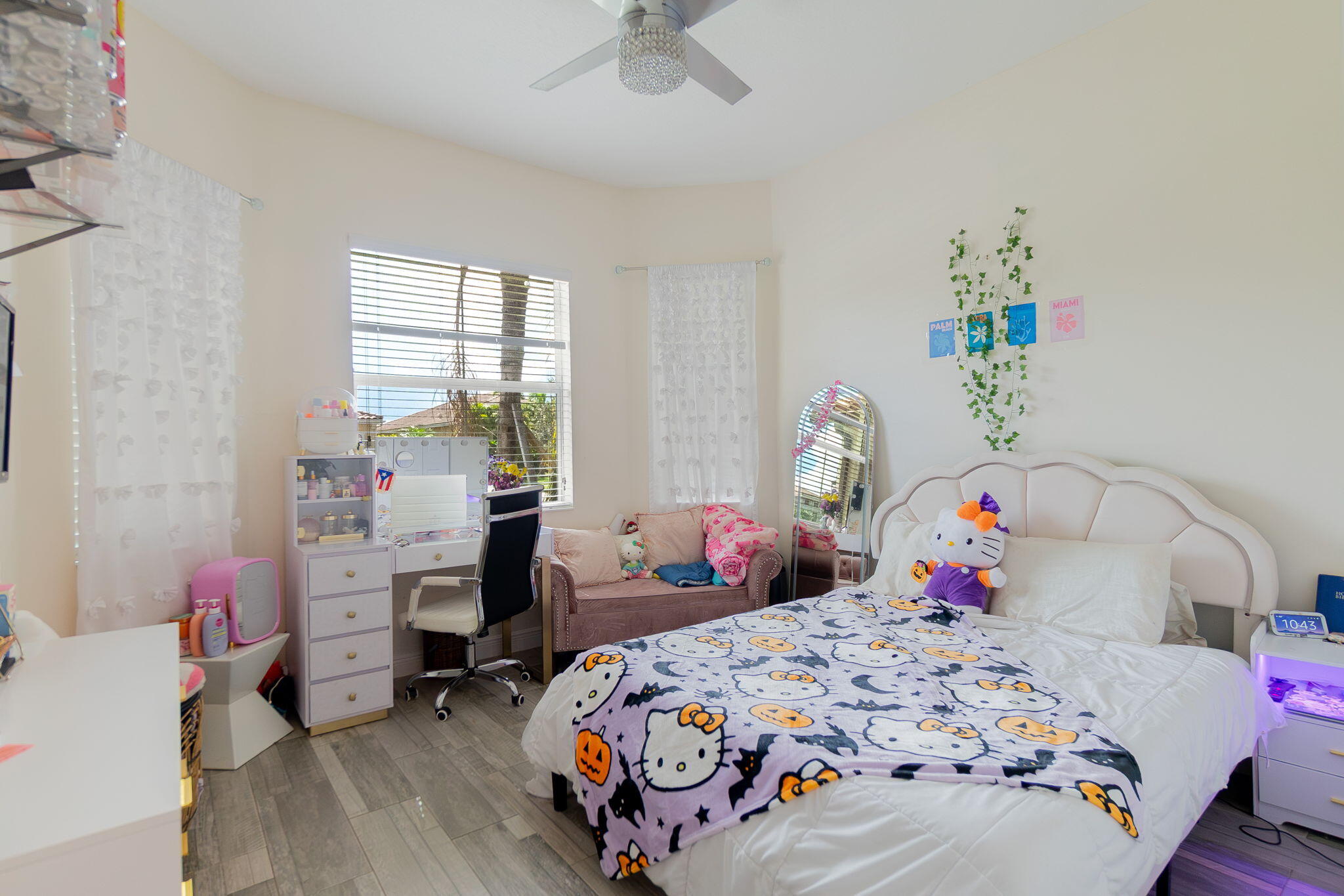 3011 Strada Court Royal Palm Beach, FL 33411 - Photo 13 of 57 a bedroom with a bed and a wooden floor