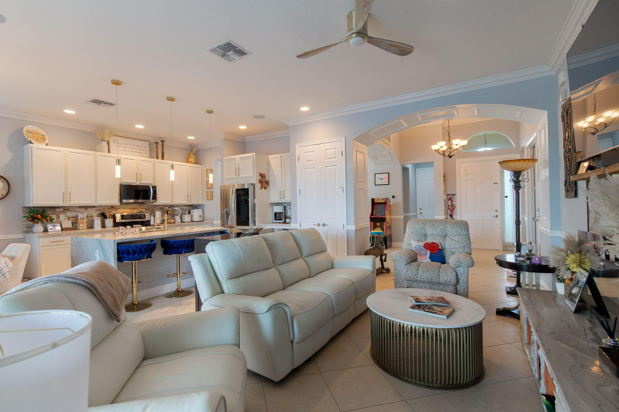 3011 Strada Court Royal Palm Beach, FL 33411 - Photo 17 of 57 a living room with furniture and a view of kitchen