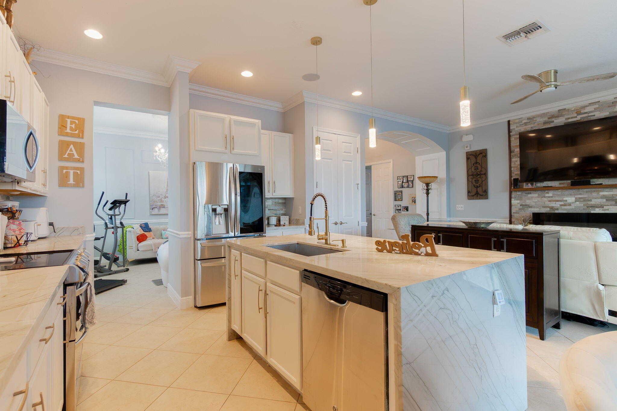 3011 Strada Court Royal Palm Beach, FL 33411 - Photo 21 of 57 a kitchen with sink stove and refrigerator