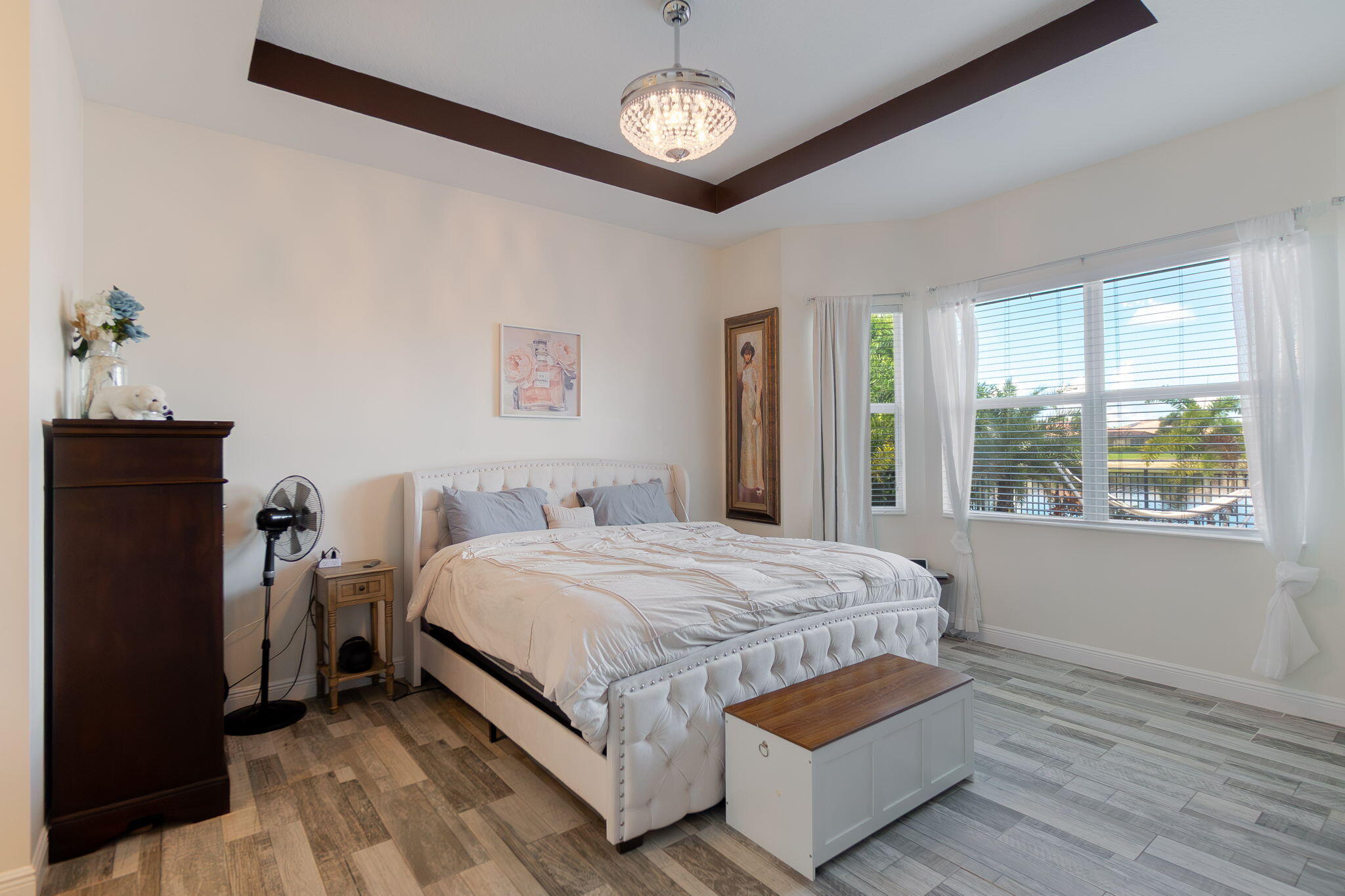 3011 Strada Court Royal Palm Beach, FL 33411 - Photo 22 of 57 a bedroom with a bed lamp and a window