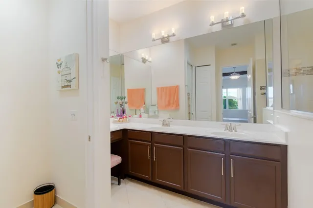 a bathroom with a toilet a sink and a window