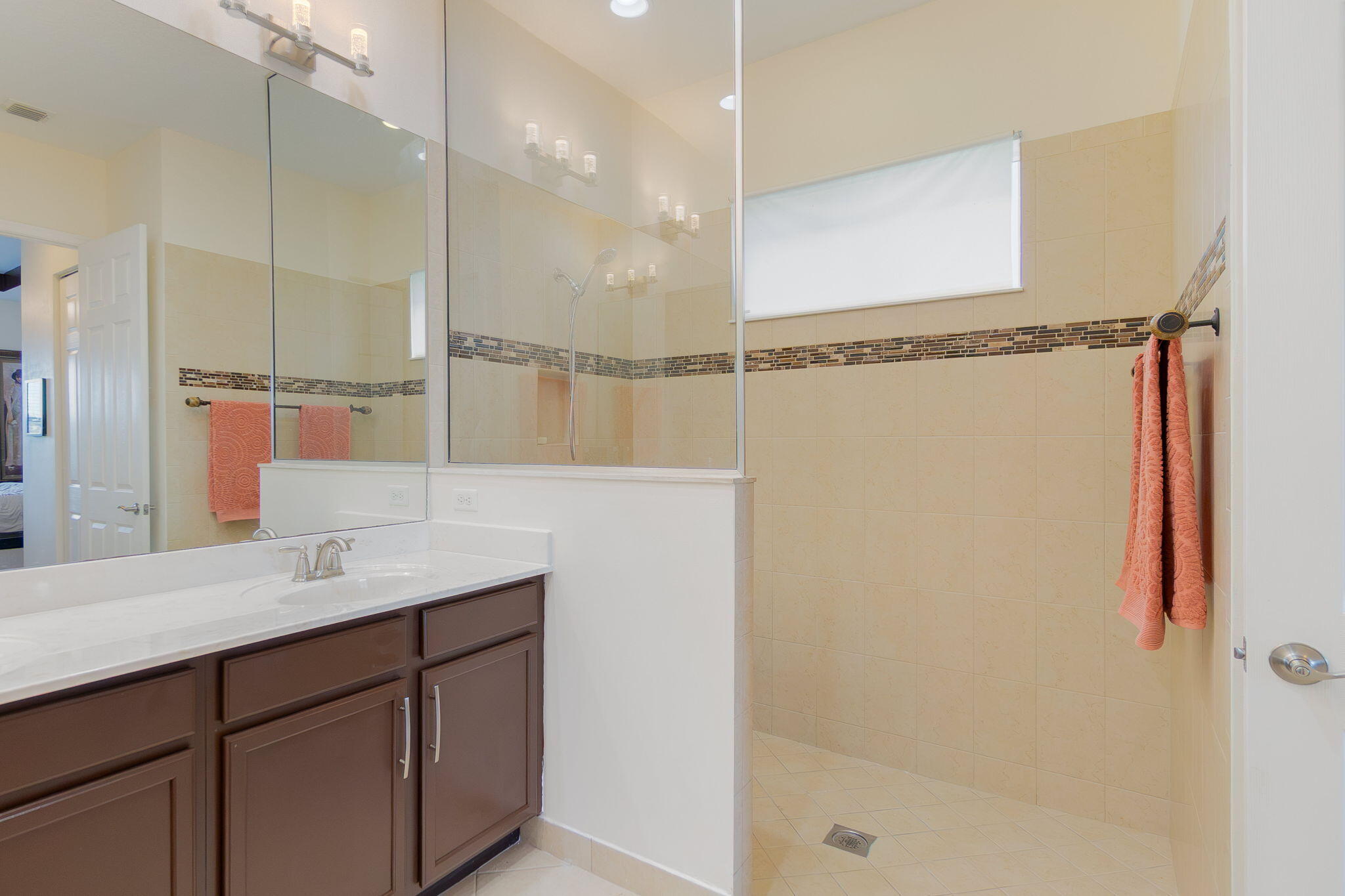 3011 Strada Court Royal Palm Beach, FL 33411 - Photo 25 of 57 a bathroom with a sink and a mirror