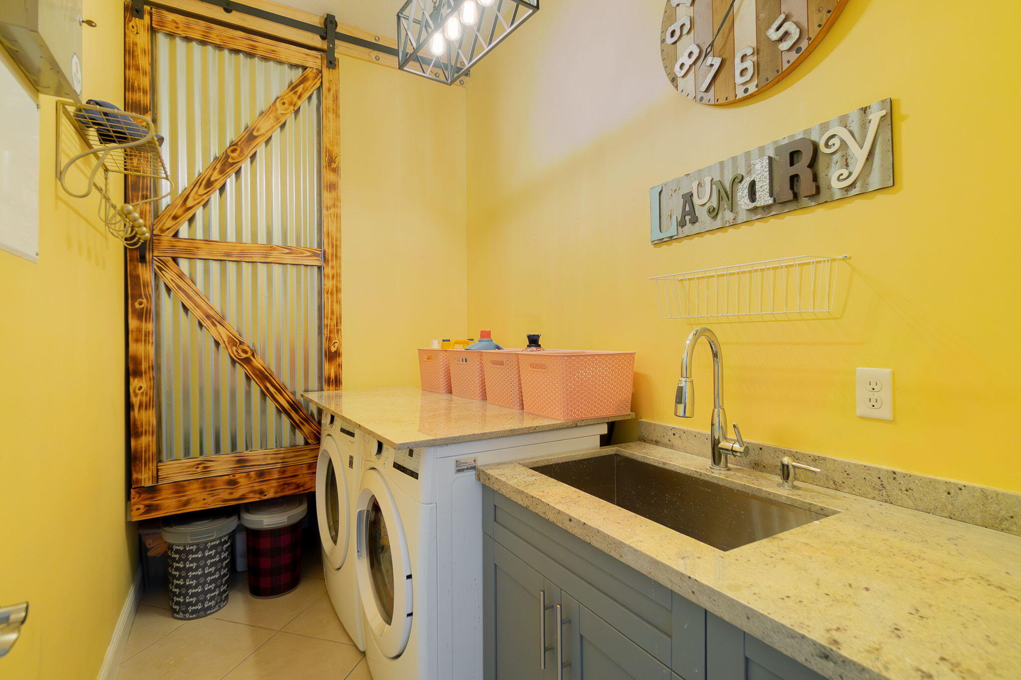 3011 Strada Court Royal Palm Beach, FL 33411 - Photo 28 of 57 a utility room with a sink a washer and dryer