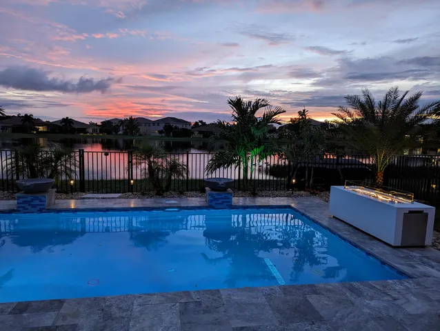 a view of outdoor space with swimming pool and furniture