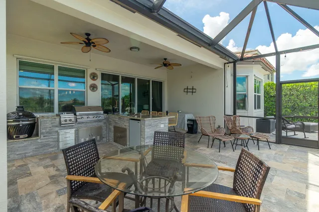 a backyard of a house with yard and outdoor seating